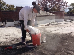 Mixing up a batch of concrete patch.